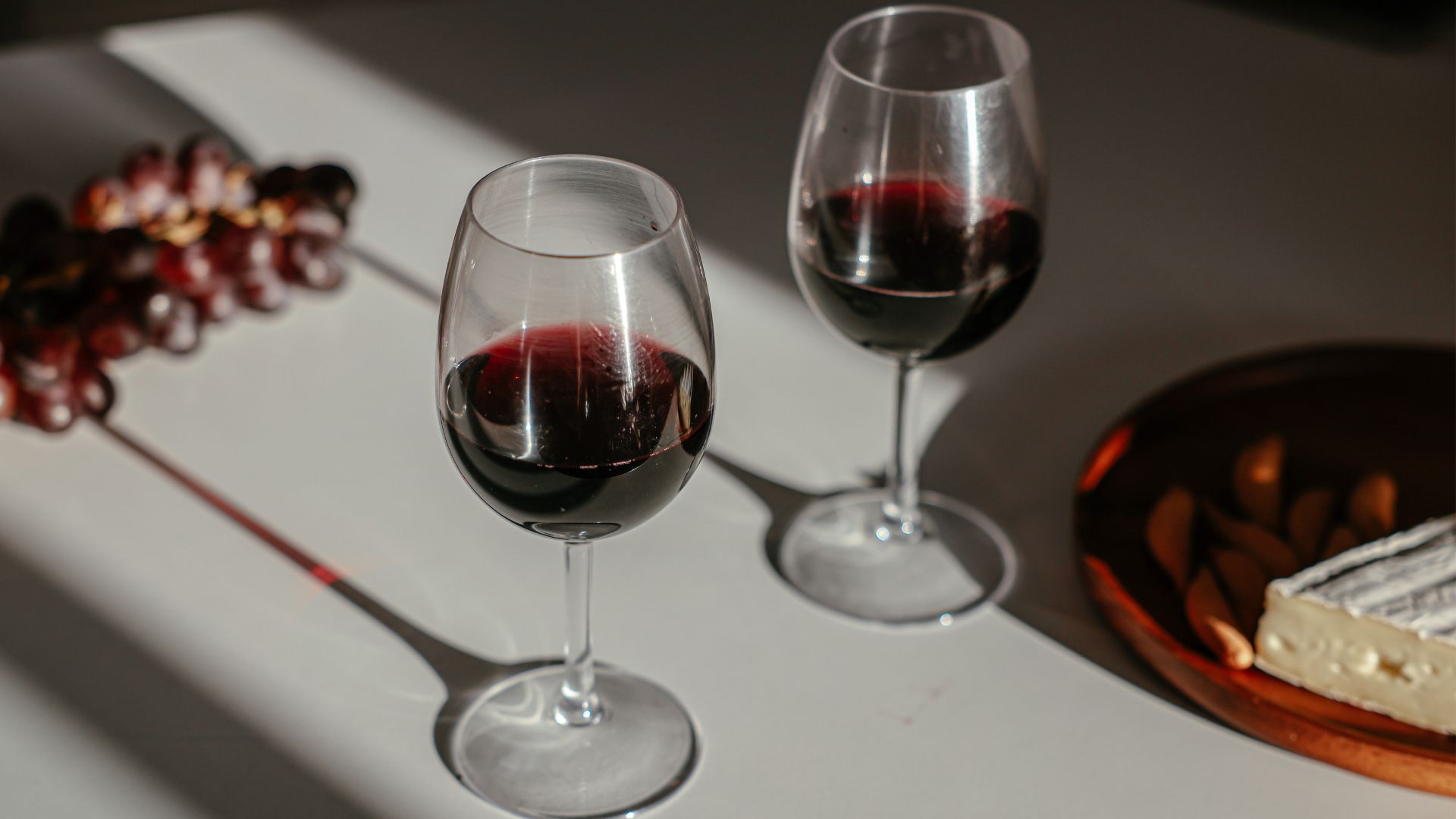 Two glasses of dry wine, deep red in color.